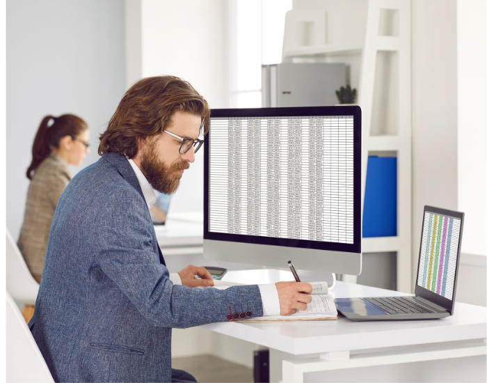 An employee consolidates investement master data in a sspreadsheet.